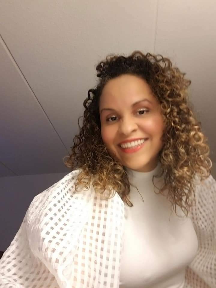 Elsa Julissa writing at her desk